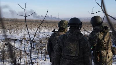 Battle rages in Ukraine town as Russia shakes up its military