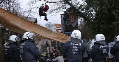 Riot police evict people from village as it's demolished to make way for coal mine