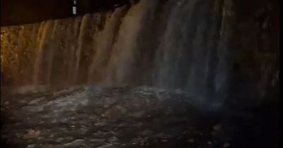 Mountain road turns into waterfall as flooding hits Wales