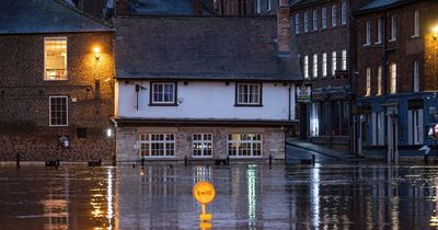 UK flooding: Pubs underwater, sewage in street and roads closed as rain batters Britain