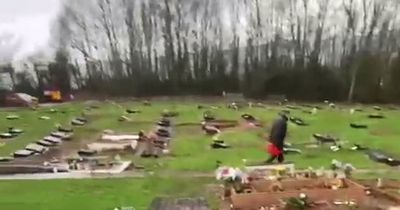 Bodies falling out of coffins as pallbearers trip over in 'horrifying' flooded cemetery