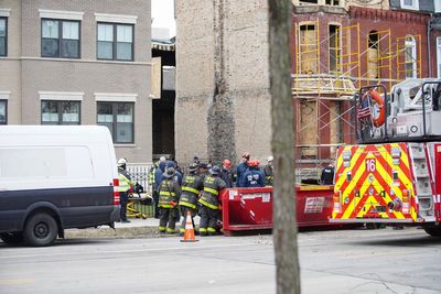 Worker injured when Chicago building gives way, trapping him