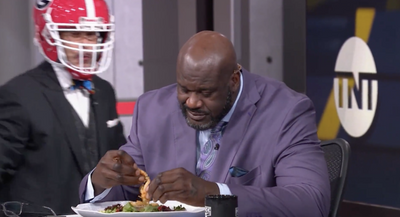 Shaq paid up on a gross national title game bet by fearlessly chowing down on frog legs