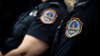 Northern Territory police officer, 46, to face court over charges of assault, making a threat to kill