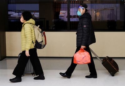 About 490,000 exit, entry trips made daily in China since Jan. 8