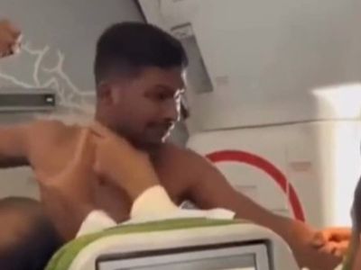 Shirtless man filmed repeatedly punching fellow passenger on flight