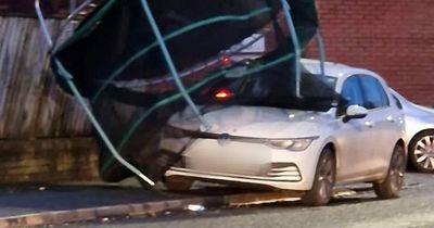 Shocking scenes as 'dangerous' winds blow trampoline onto car in Leeds