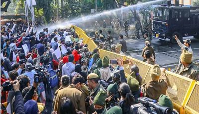 Delhi Police Use Water Cannons Against AAP Workers Protesting Slum Demolition