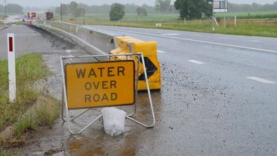 Three women rescued from flood waters, with severe weather 'yet to peak' for north and central Queensland