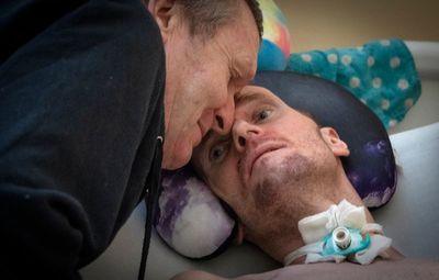 A loving dad and his injured son pay war's costs in Ukraine