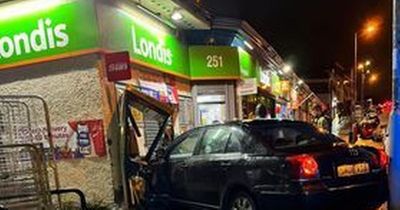 Audi crashes into front of shop in three car smash on busy Rutherglen road