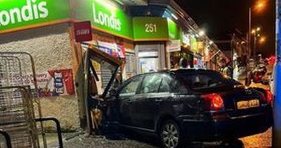 Car ploughs into Glasgow shop after three-vehicle smash on busy street