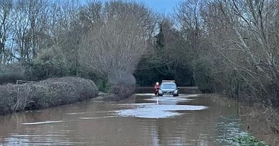 Firefighters save baby trapped in car as reckless driver slammed for going through flood