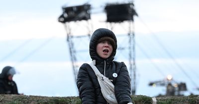 Greta Thunberg is carried away by police as anti-coal mining protest turns violent