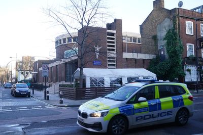 Man arrested on suspicion of attempted murder after drive-by shooting outside Catholic church