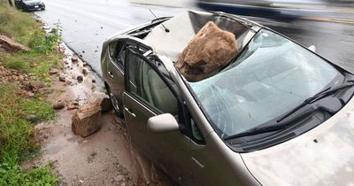 Man narrowly escapes death as giant boulder crushes car immediately after he gets out