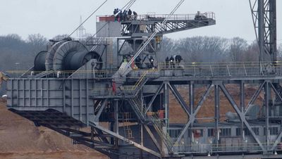 Climate activists occupy giant digger at German coal mine
