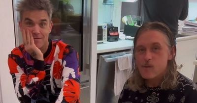 Take That fans go wild as Robbie Williams and Mark Owen reunite in bizarre video