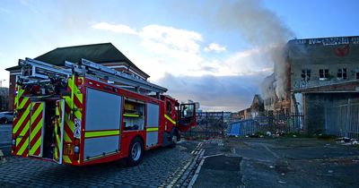 Glass smashes as firefighters battle abandoned building blaze