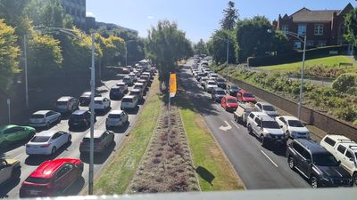 Tasman Bridge truck rollover brings Hobart to a standstill — how it unfolded