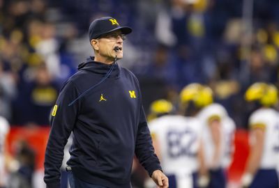 Broncos coach candidate Jim Harbaugh to remain at Michigan