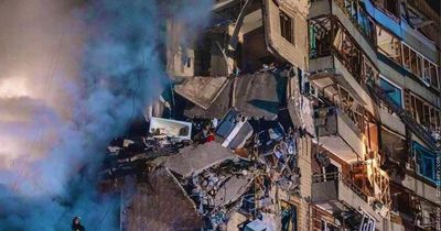 Terrified woman seen amid rubble on 7th floor of building hit by Russian missile