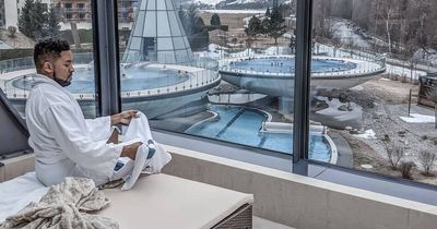 Hotel guests enjoy breakfast in bed outside in the snow at lavish ski resort