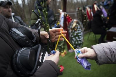 Funerals begin for dozens of people killed in an attack on a Dnipro apartment complex