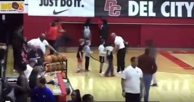 Man shot at US high school basketball match as terrified young children flee court