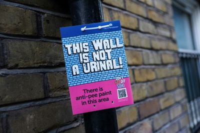 London takes aim at public peeing with splash-back paint