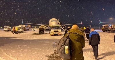 Snow closes UK airport on coldest day of the year as Met Office issues weather warnings