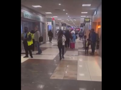 Woman arrested at Atlanta airport after spraying passengers and staff in the face with fire extinguisher