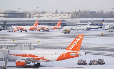 Flights resume at Manchester Airport after runways shut by snow on UK’s coldest night of year