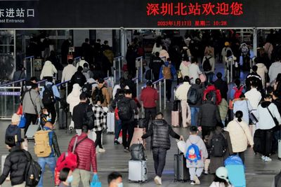 Tens of millions head home for China holidays as Xi flags Covid worry