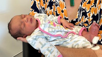 Baby born in North Queensland mountain village cut off by wild weather makes it to hospital