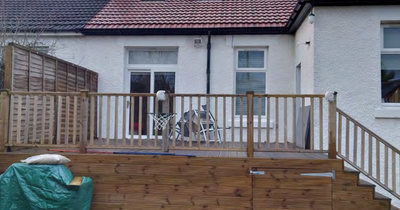 Glasgow woman ordered to tear down garden decking amid privacy row with neighbour