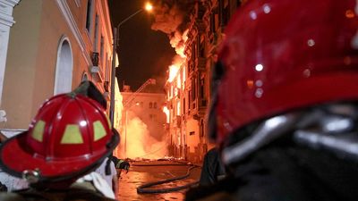 Historic building catches fire in Peru's capital amid clashes between police and protesters