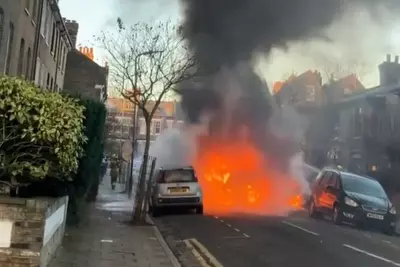 Children evacuated from school bus after it erupts in flames in street