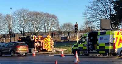 Gritter driver rushed to hospital after vehicle overturns onto side on A9