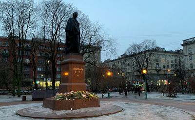 Russians lay flowers at improvised memorials to commemorate Dnipro dead