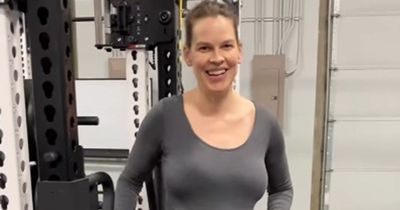 Hilary Swank, 48, shows off huge baby bump during gym workout ahead of birth of twins