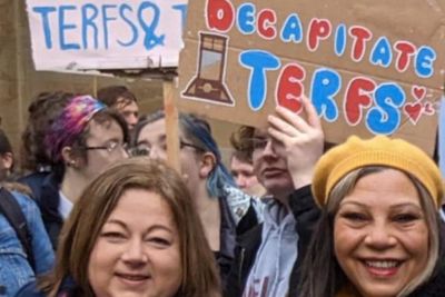 Row erupts as SNP MPs pictured near 'decapitate TERFS' sign at protest