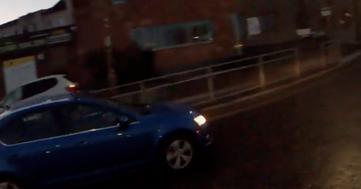 Edinburgh cyclist narrowly avoids being knocked off bike by car on busy roundabout