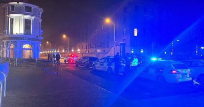 Major city centre road closed after 'police car involved in late-night crash'
