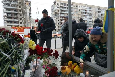 Dnipro mourns dozens of victims of tower block missile strike