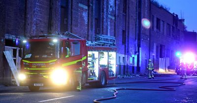 Fire crews close road after tyre fire breaks out near abandoned warehouse