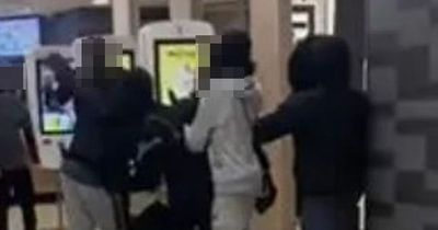 Brawl breaks out inside McDonalds as thugs throw punches in front of horrified kids