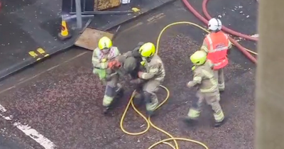 Moment Edinburgh firefighters rescue hero colleague from burning Jenners building