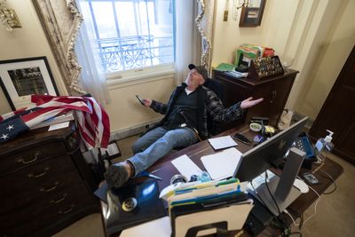 Man photographed with foot on Pelosi’s desk on Jan 6 found guilty