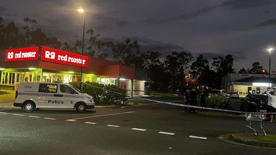 Police search for gunman after man shot in the arm at a Gold Coast fast-food car park